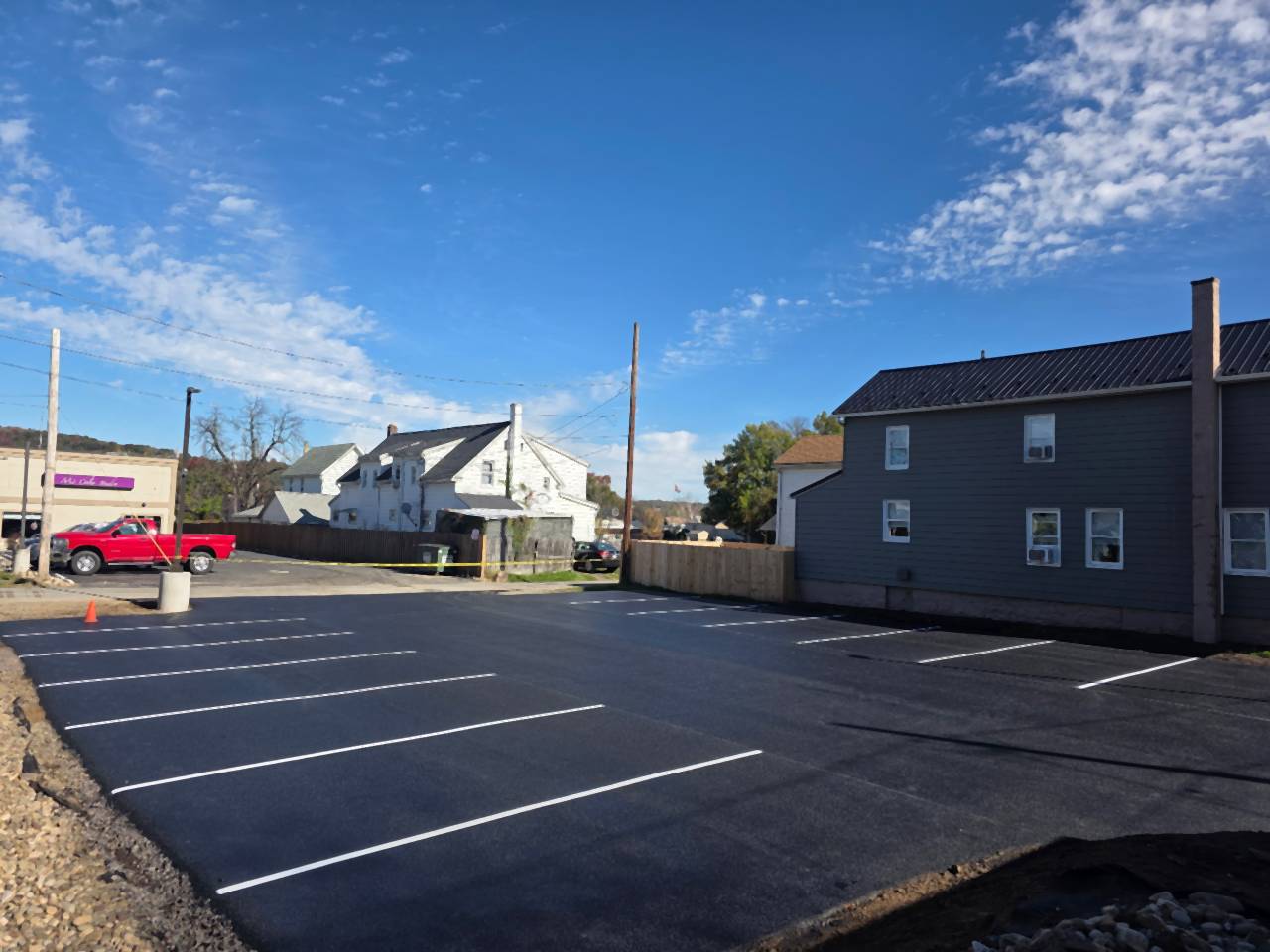 Small parking lot finished and striped after paving.